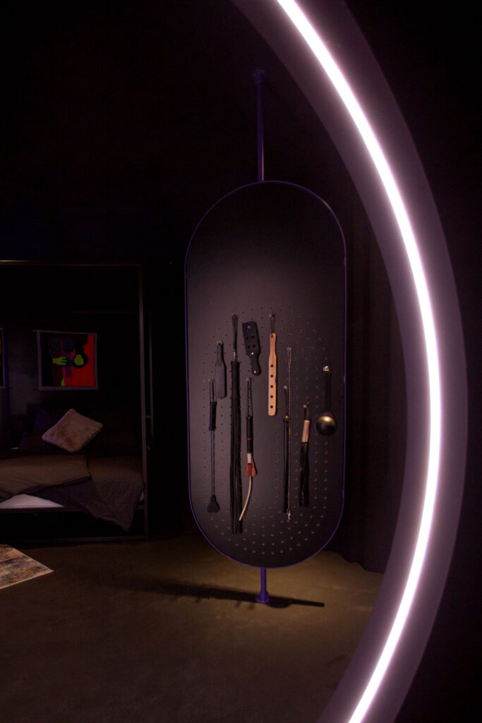 Custom made, mirrored and revolving paravent displaying whips in the Circle Berlin, a kinky apartment for lovers.