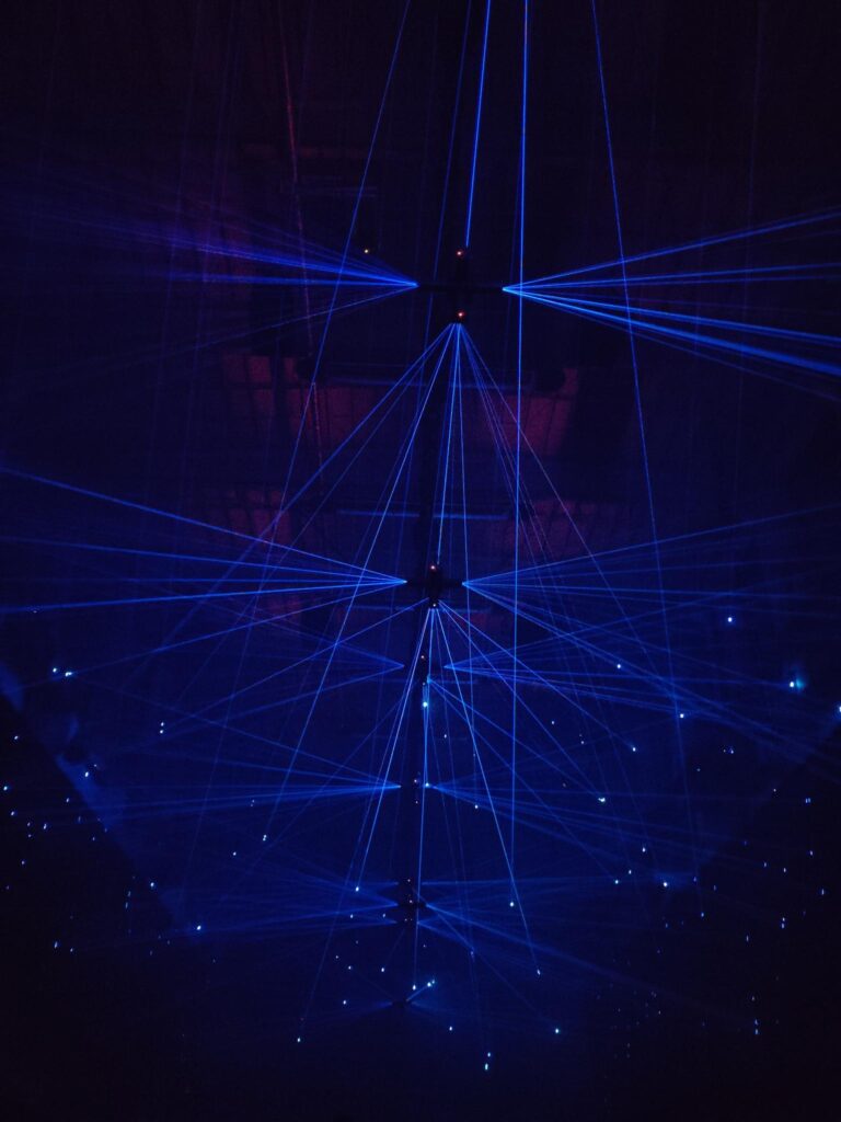 Blue and black ambient lights at Kraftwerk Berlin exhibition by Dark Matter artists, creating immersive sensory design.